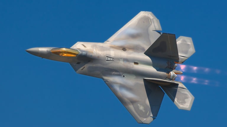 Air Force Arms F-22s With New Weapons, Changing Attack Tactics