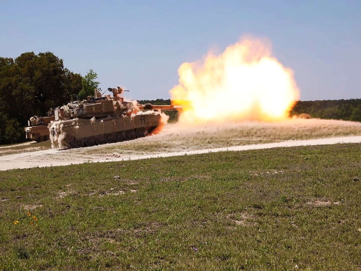 A M1A2 SEPV3 Abrams Tank fires at multiple range targets during a range warfighter exercise, April 11, 2021, Fort Hood, Texas. The visit with foreign allies allows the U.S. Army to boost interoperability of staff members and warfighting capabilities with the M1A2 SEPv3 Abrams Tank. (U.S. Army photo by Sgt. Melissa N. Lessard)
