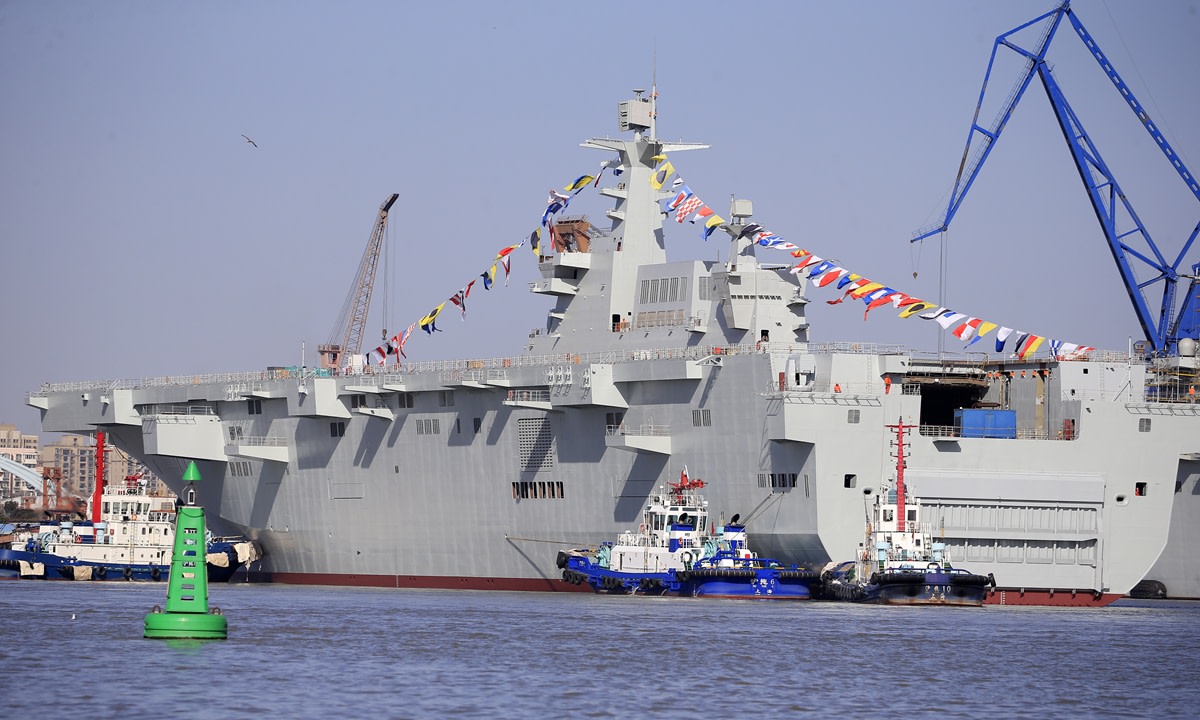 China's third Type 075 amphibious assault ship was launched from the Hudong-Zhonghua Shipyard in Shanghai on January 29, 2021. Many military enthusiasts gathered to witness the launch, and were amazed with the second and third Type 075s now both moored by the Huangpu River bank for further outfitting work. Photo: Yang Hui/GT