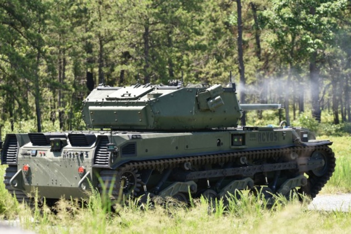 A Robotic Combat Vehicle-Medium fires a around at a target during the vehicle’s live fire testing at Fort Dix, N.J., June 30, 2021. The testing prepares the vehicle’s systems and the engineers who design and operate it the opportunity to exercise its capabilities before the 2022 Soldier Operational Experiment at Fort Hood, Texas. (U.S. Army photo by Angelique N. Smythe/Released) (Angelique N. Smythe, Picatinny Arsenal Public Affairs)
