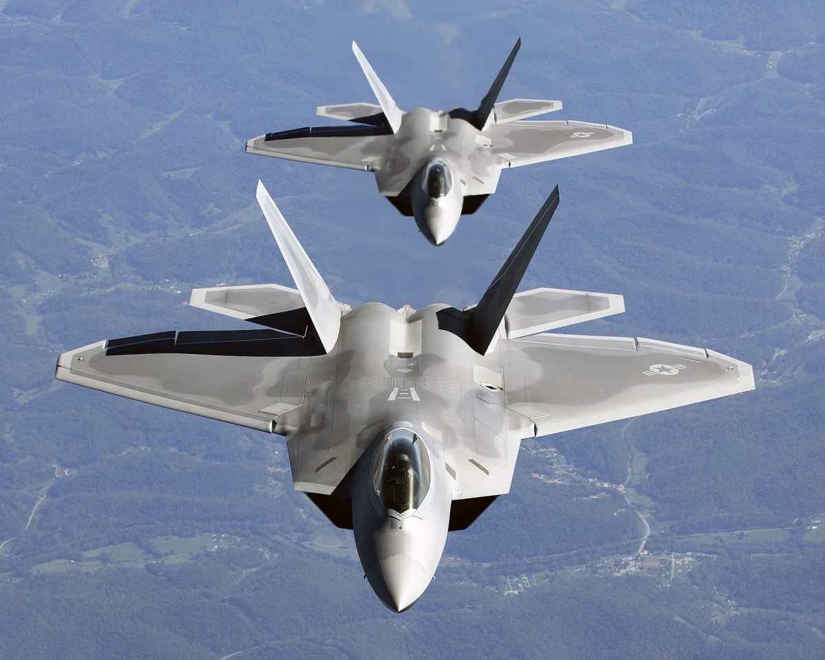 Two F-22As in close trail formation