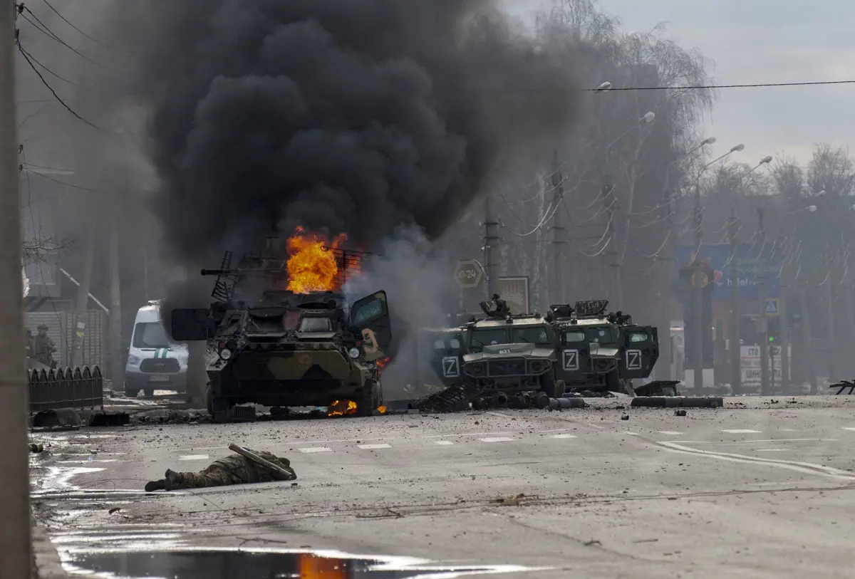 A Russian armored personnel carrier burns after fighting in Kharkiv, Ukraine. Ukrainian forces engaged in fighting with Russian troops that entered the country’s second-largest city on Sunday.(Marienko Andrew / Associated Press)