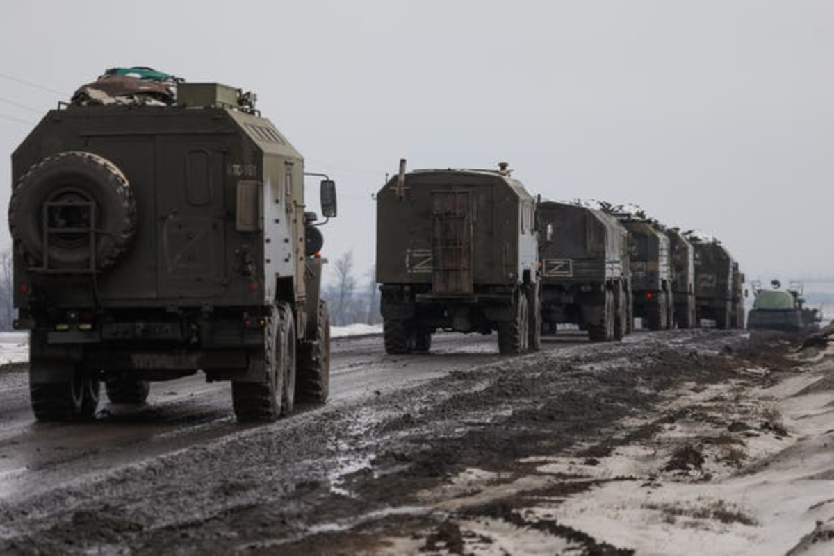 A column of Russian military vehicles is seen near the village of Oktyabrsky, Belgorod Region, near the Russian-Ukrainian border