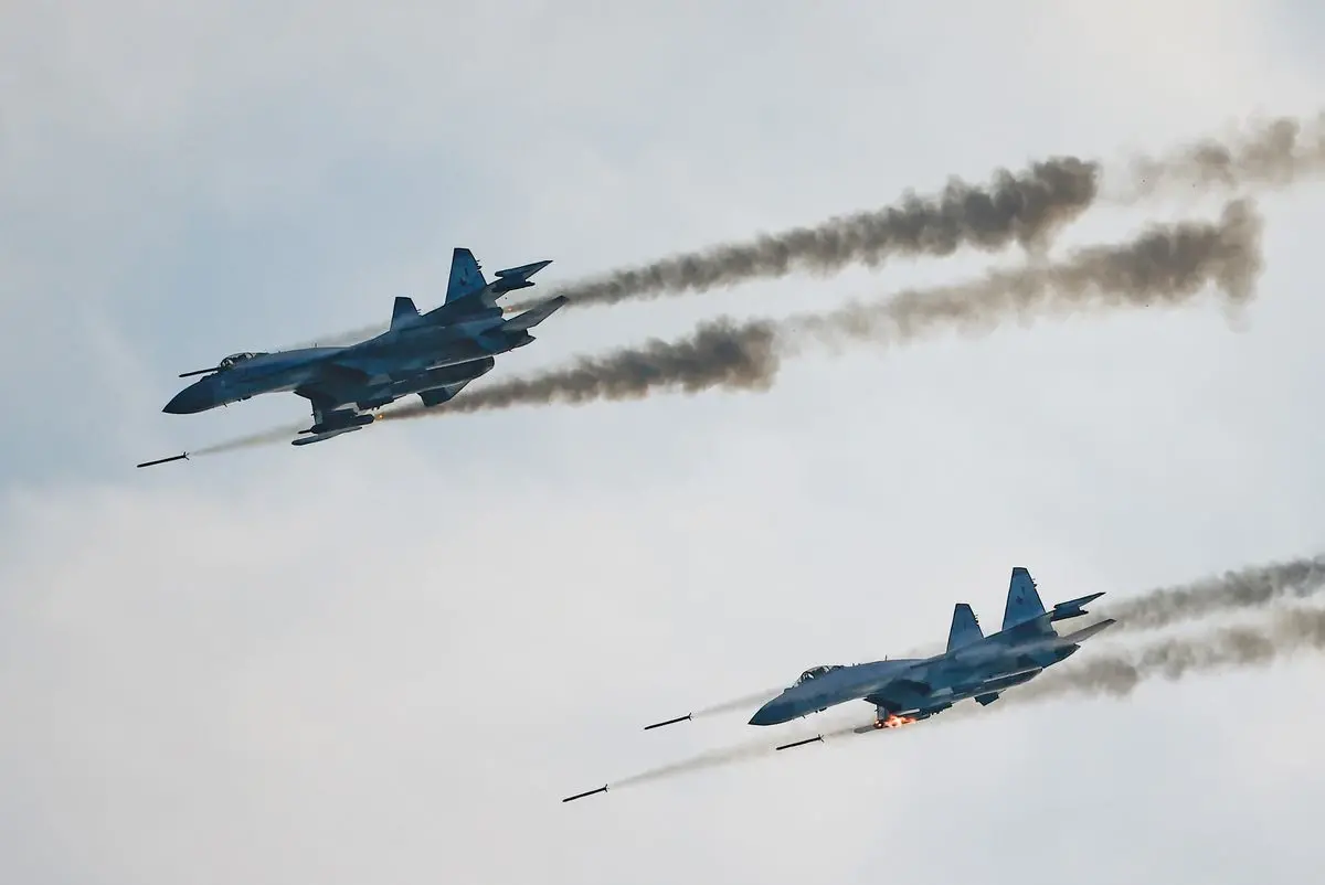 Russian Sukhoi Su-35 jet fighters fire missiles during the Aviadarts competition, as part of the International Army Games 2021, at the Dubrovichi range outside Ryazan, Russia August 27, 2021. REUTERS/Maxim Shemetov/File Photo