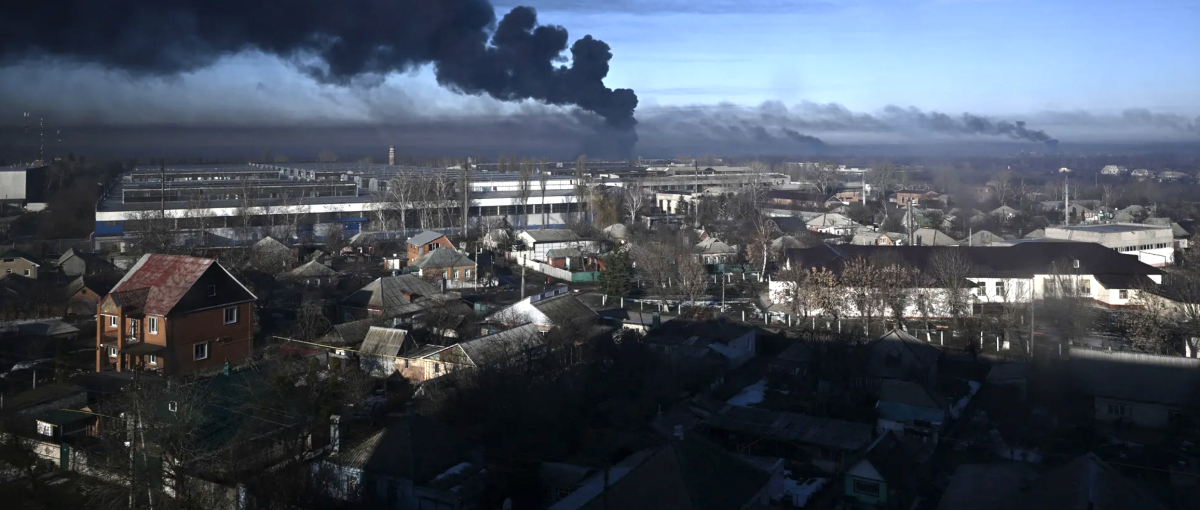 Black smoke rises from a military airport in Chuguyev near Kharkiv, Ukraine, on February 24. 