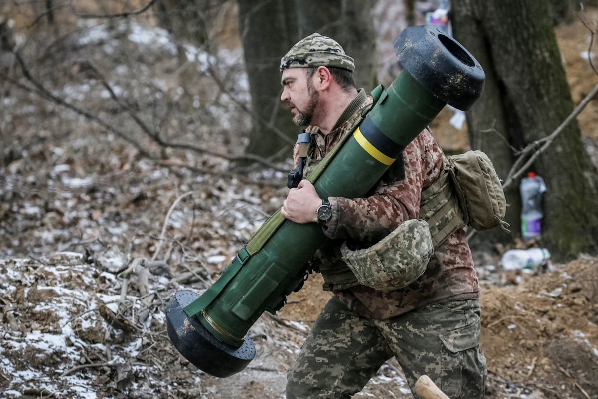 A Ukrainian service member holds a Javelin missile system on the front line in the north Kyiv region on March 13.