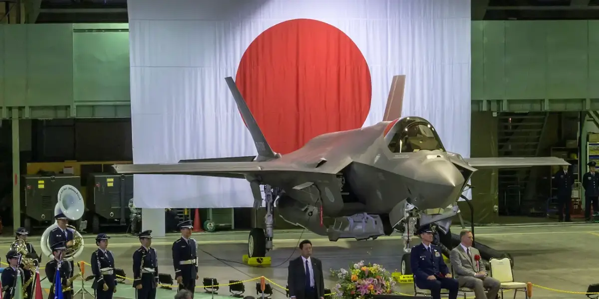 Senior leaders from Japan's Ministry of Defense, US Forces Japan, Pacific Air Forces, and Lockheed Martin at a Japan Air Self-Defense Force hangar to welcome the first operational F-35A Lightning II to JASDF's 3rd Air Wing, at Misawa Air Base, Japan, February 24, 2018. 