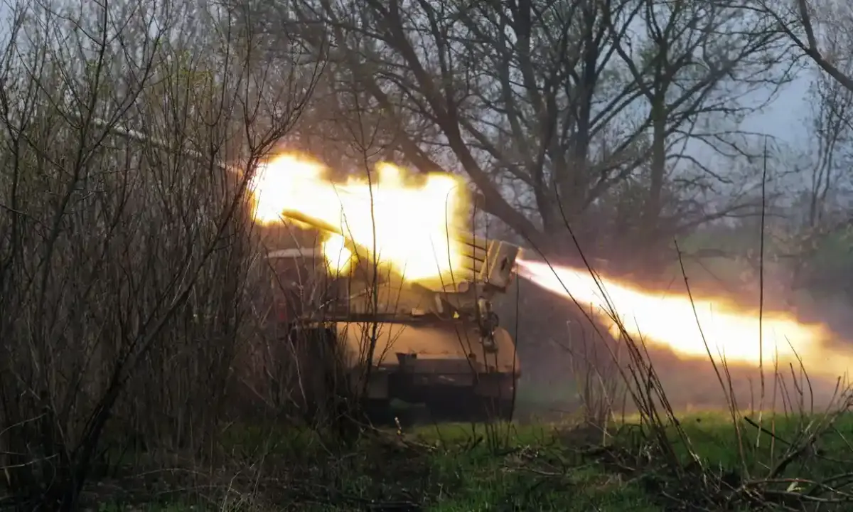 Ukrainian service personnel firing a multiple rocket launcher from their position in the Kharkiv area. Photograph: EPA