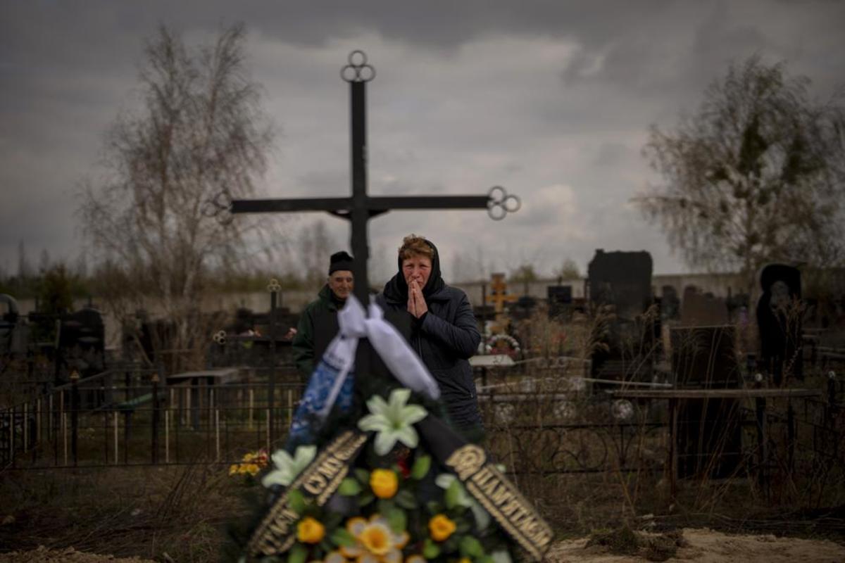Galyna Bondar, mourns next to the grave of her son Oleksandr, 32, after burying him at the cemetery in Bucha, in the outskirts of Kyiv, Ukraine, April 16, 2022. Oleksandr, who joined the territorial Ukrainian defence as a co-ordinator was killed by a gunshot by the Russian Army. Three months after it invaded Ukraine hoping to overtake the country in a blitz, Russia has bogged down in what increasingly looks like a war of attrition with no end in sight.