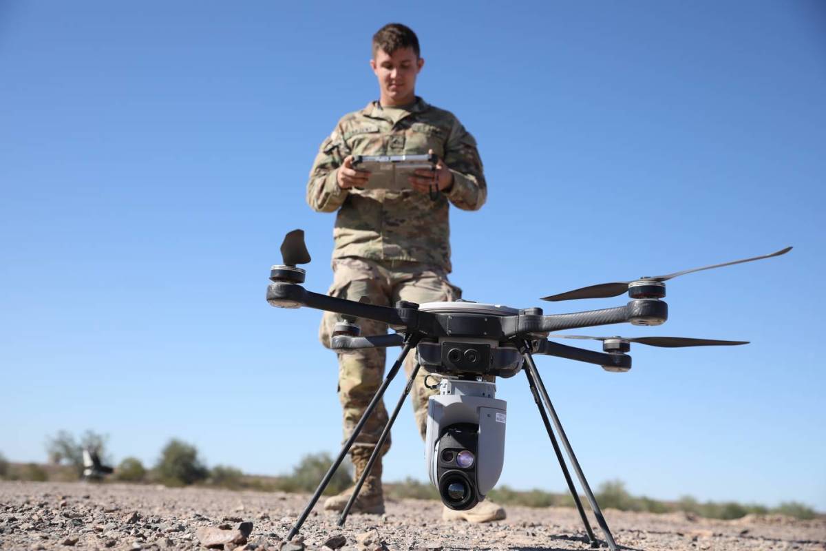 U.S. Army Pfc. Benjamin Sargent, assigned to 82nd Airborne Division, prepares a multimission payload drone for launch during Project Convergence at Yuma Proving Grounds, Ariz., on Oct. 26, 2021. (Sgt. Marita Schwab/U.S. Army)