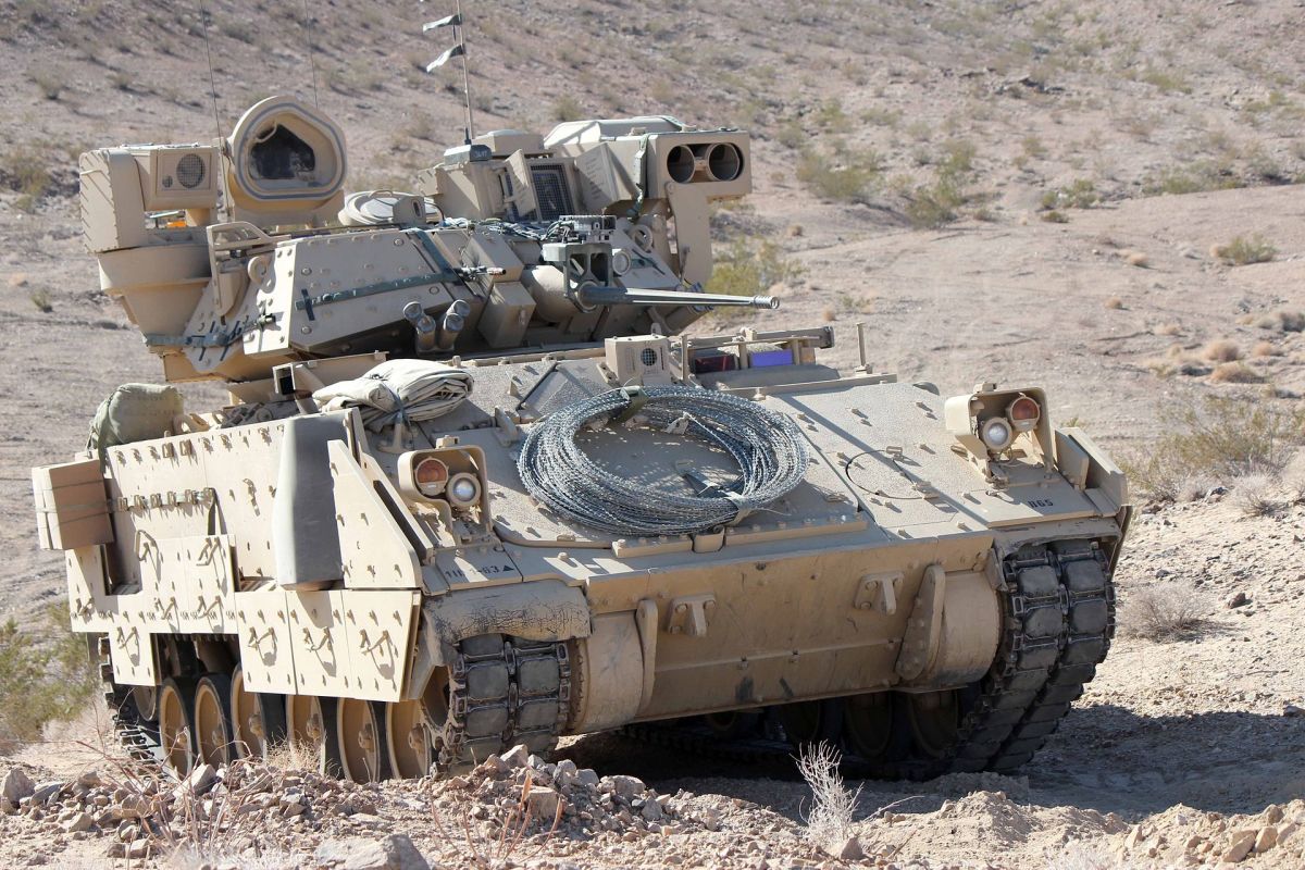 An M2 Bradley Fighting Vehicle is on display during a training exercise at the National Training Center in Fort Irwin, Calif., Feb. 18, 2013. The live, virtual and constructive training environment of the National Training Center is designed to produce adaptive leaders and agile forces for the current fight, which are responsive to the unforeseen contingencies of the 21st century. (U.S. Army photo by Sgt. Eric M. Garland II/Released)
