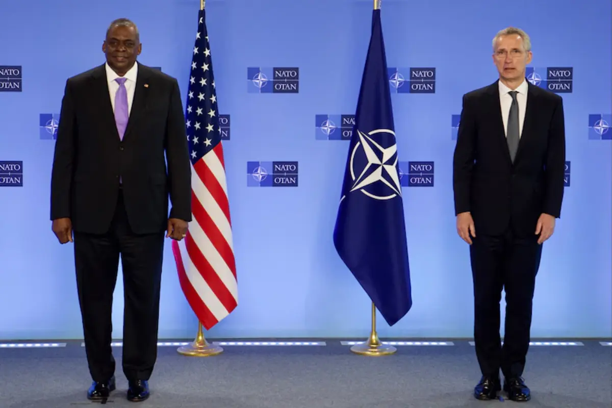Secretary of Defense Lloyd J. Austin III and NATO Secretary General Jens Stoltenberg stand together at NATO headquarters, April 14, 2021.