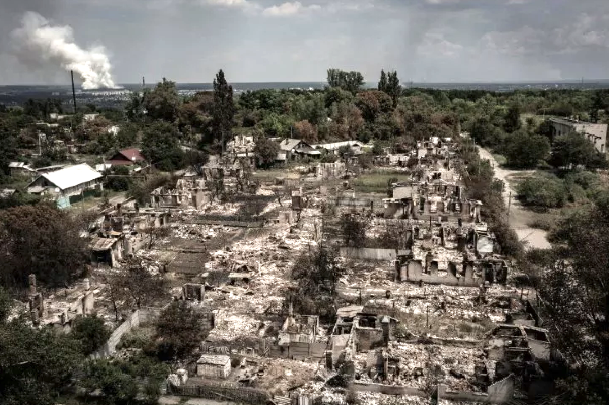A Russian defense official is pushing Ukraine to surrender in Severodonetsk, while pledging to allow civilian evacuation. Above, an aerial view shows destroyed houses after a strike in the town of Pryvillya in the eastern Ukrainian region of Donbas on June 14, 2022.