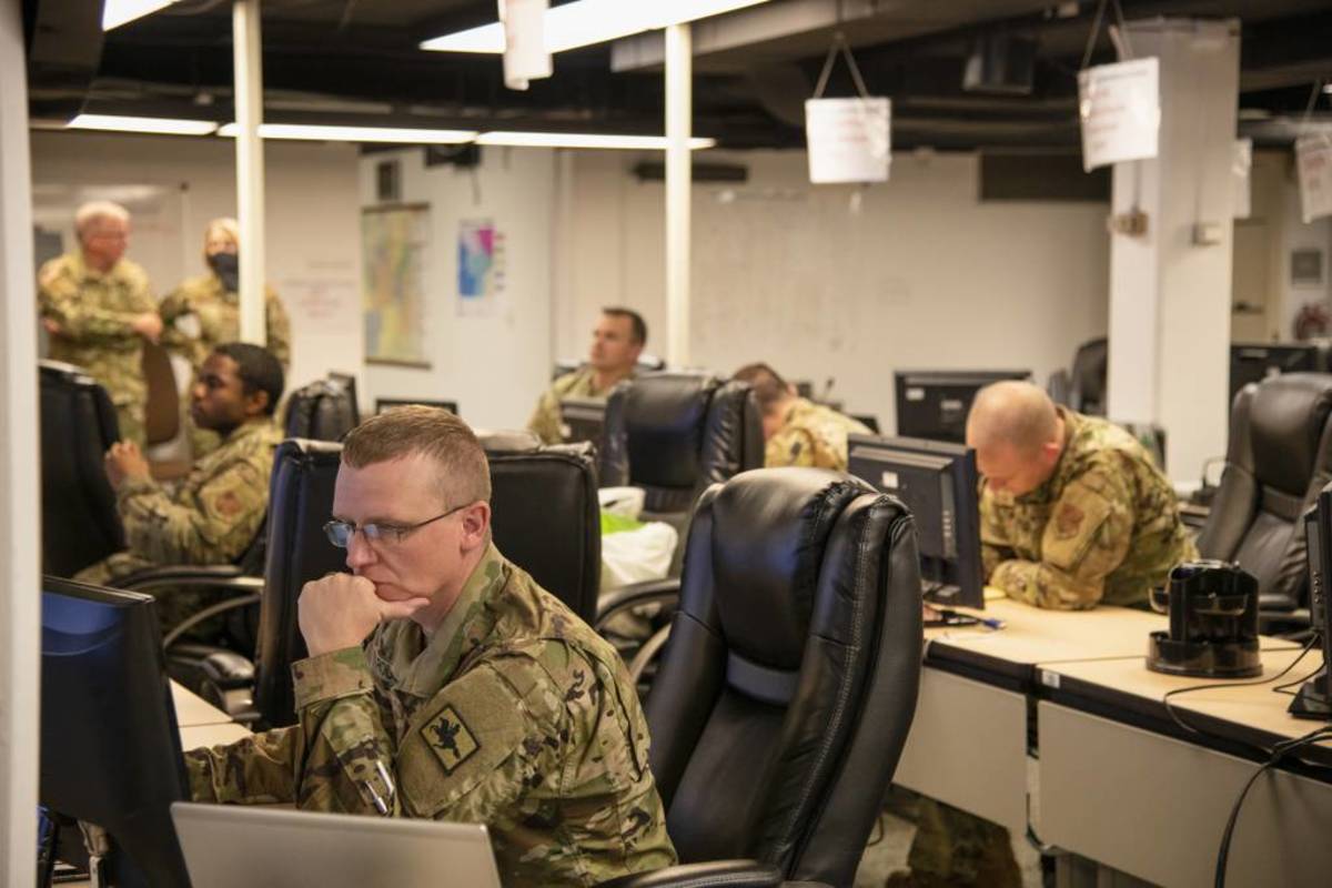 Service members from the Wyoming Army and Air National Guard, plus Wyoming state employees, gather together to participate in a Cyber Shield exercise at the Wyoming Office of Homeland Security on Sept. 28, 2020. (Cpl. Kristina Kranz)