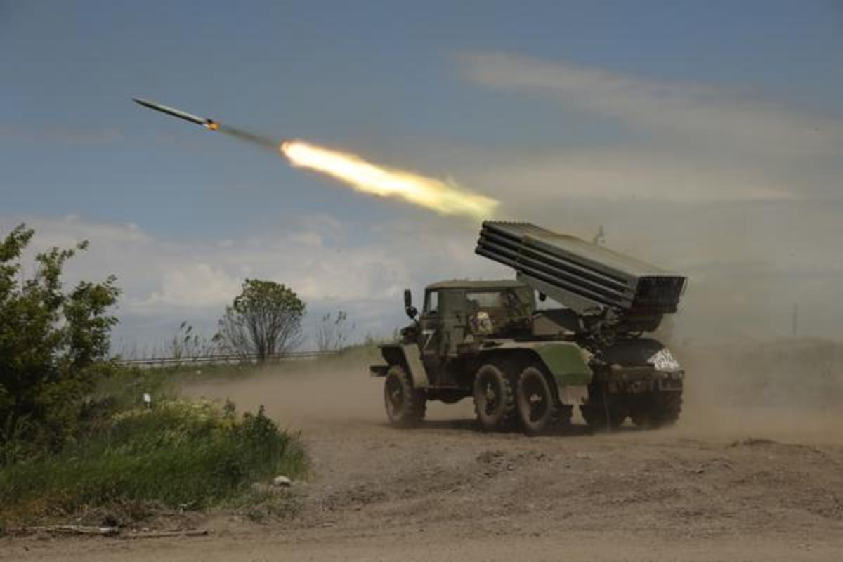 FILE - A Donetsk People's Republic militia's multiple rocket launcher fires from its position not far from Panteleimonivka, in territory under the government of the Donetsk People's Republic, eastern Ukraine, Saturday, May 28, 2022. Day after day, Russia is pounding the Donbas region of Ukraine with relentless artillery and air raids, making slow but steady progress to seize the industrial heartland of its neighbor. With the conflict now in its fourth month, it’s a high-stakes campaign that could dictate the course of the entire war. 