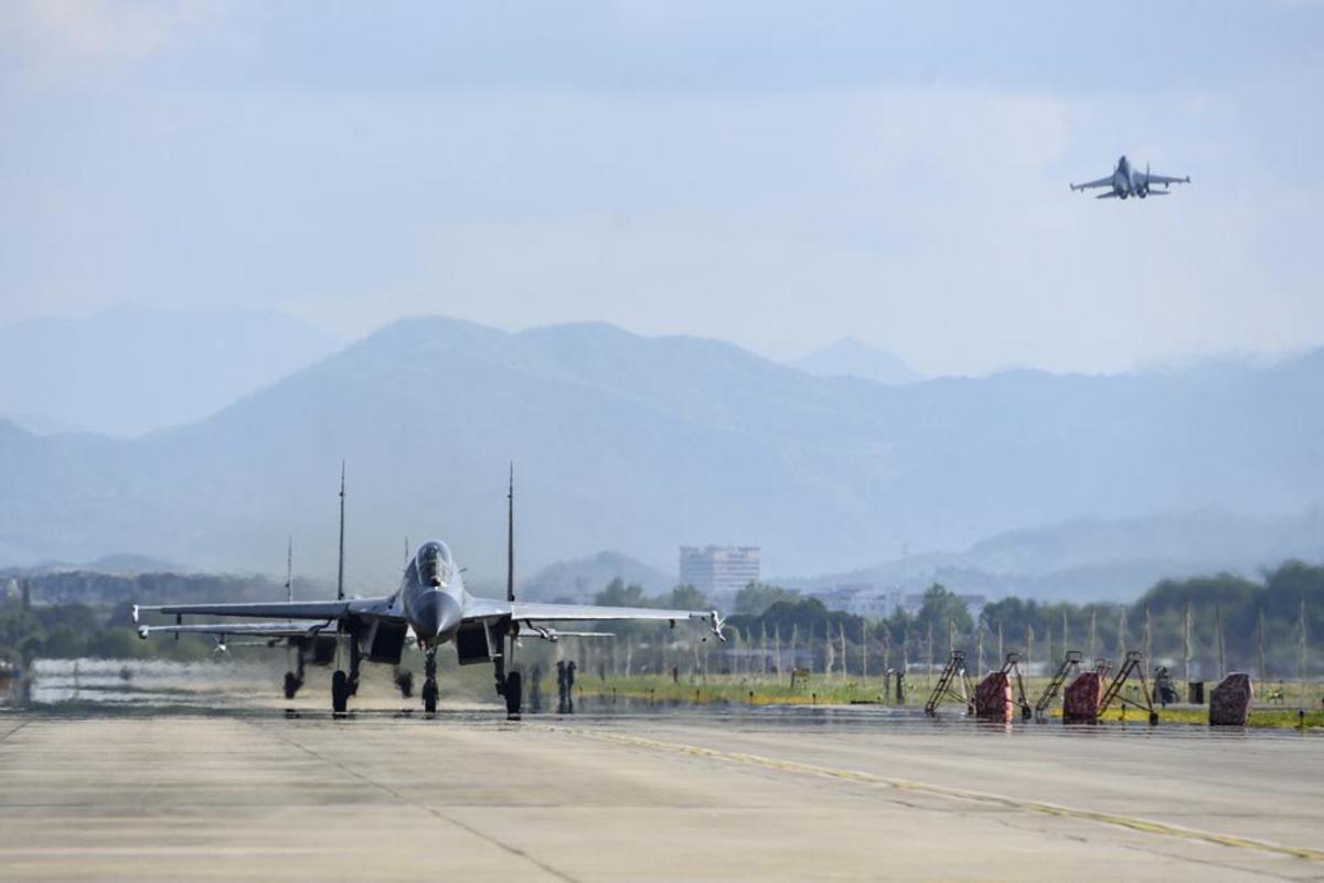 In this photo released by China's Xinhua News Agency, air force and naval aviation corps of the Eastern Theater Command of the Chinese People's Liberation Army (PLA) fly planes at an unspecified location in China, Thursday, Aug. 4, 2022. China conducted "precision missile strikes" Thursday in waters off Taiwan's coasts as part of military exercises that have raised tensions in the region to their highest level in decades following a visit by U.S. House Speaker Nancy Pelosi. (Fu Gan/Xinhua via AP)