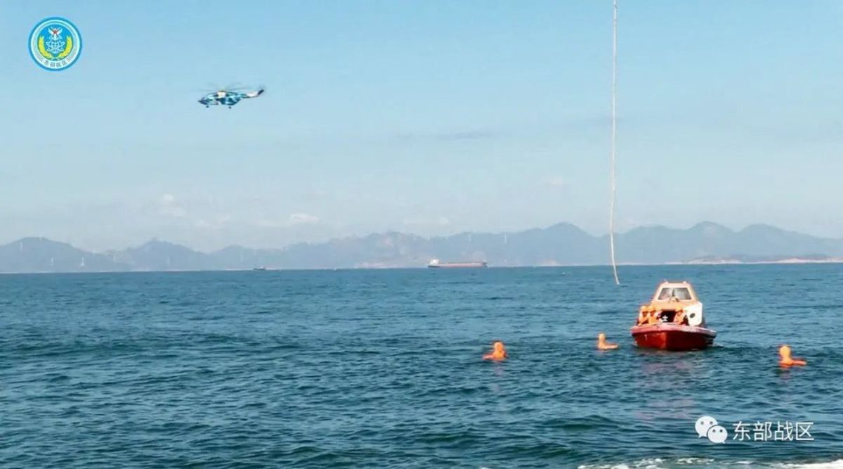 A helicopter and boat under the Eastern Theatre Command of China's People's Liberation Army (PLA) take part in a maritime rescue drill, as part of military exercises in the waters around Taiwan, at an undisclosed location August 9, 2022 in this handout image released on August 10, 2022. 