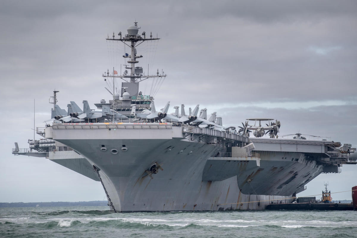 The USS Harry S. Truman, which has its home port in Norfolk, is pictured anchored in The Solent on October 8, 2018 near Portsmouth, England. The nuclear powered aircraft carrier is named after the 33rd president of the United States and has a crew of more than 5,000. The Nimitz-class ship, launched in 1998, carries more than 70 helicopters and fixed-wing aircraft. (Photo by Matt Cardy/Getty Images)