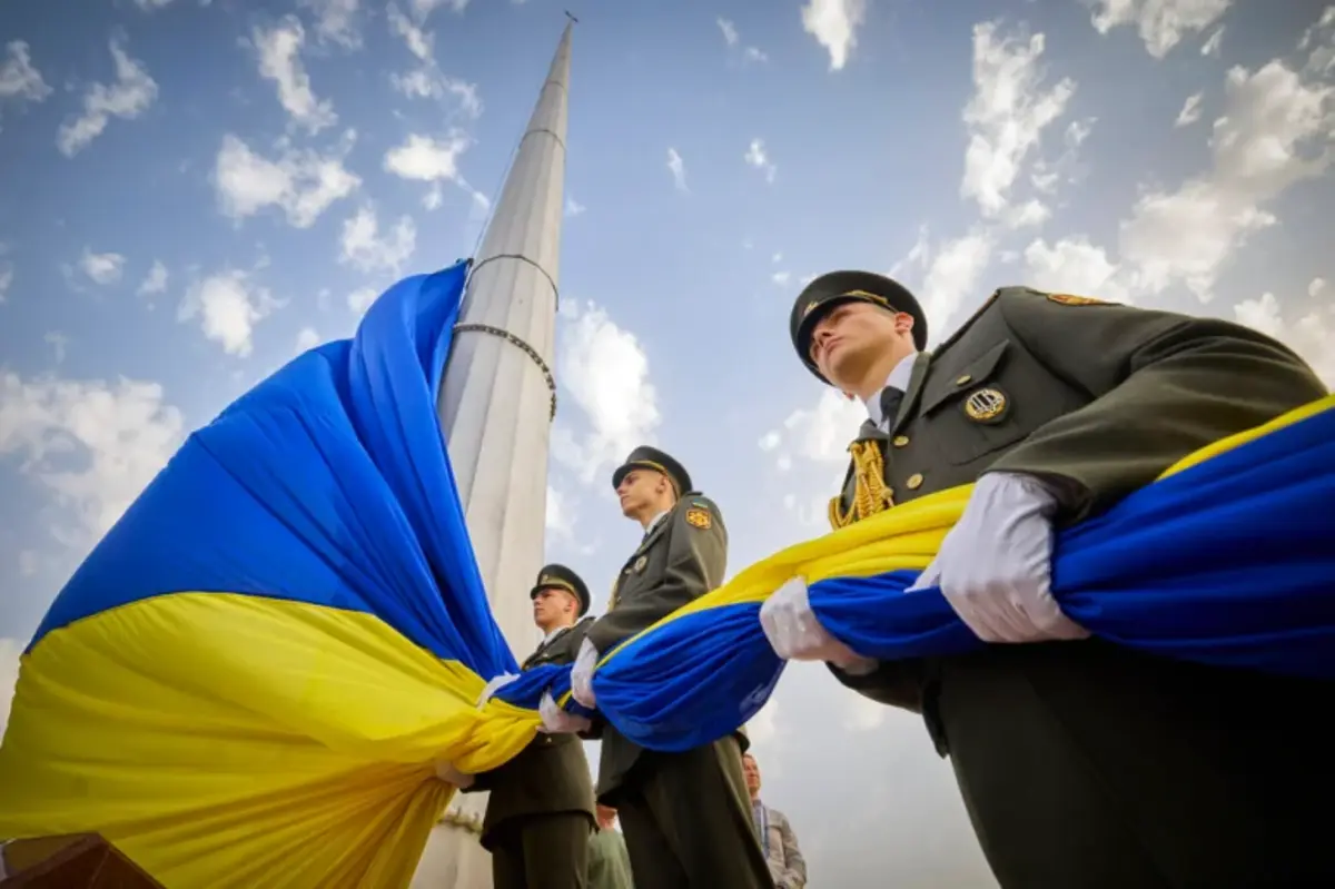 An honour guard of soldiers prepares to raise the Ukrainian national flag during State Flag Day celebrations in Kyiv, Ukraine on August 23, 2022