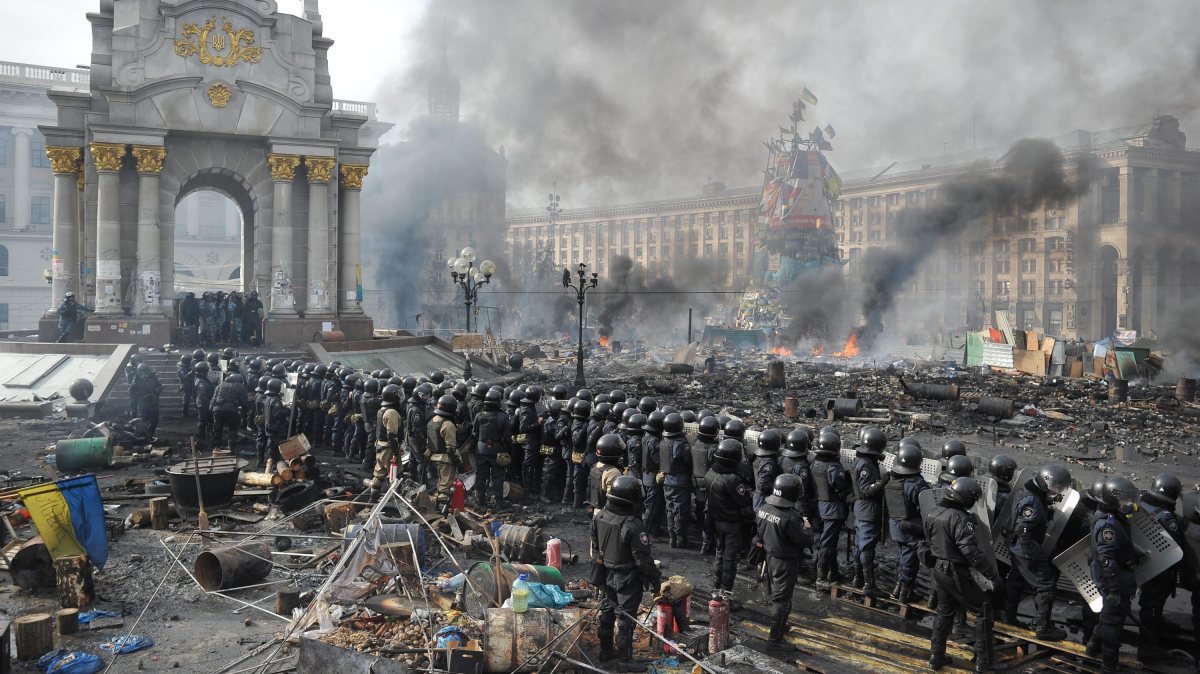 Anti-government protesters guard the perimeter of Independence Square, known as Maidan in Kiev. Police dismantled some of the barricades, but, the AP noted, “the 20,000 demonstrators fought back, armed with rocks, bats and firebombs and singing the Ukrainian national anthem.”